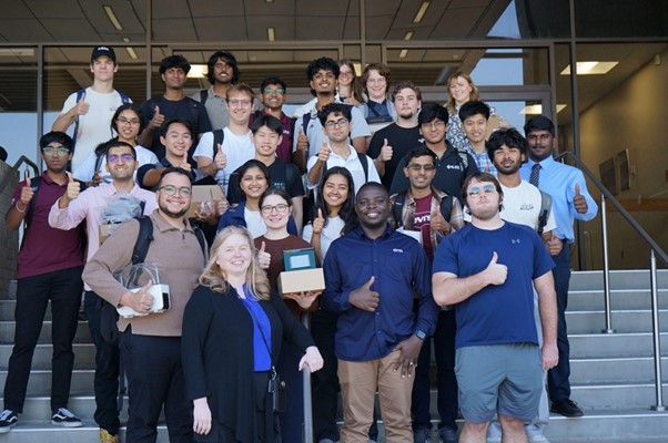 Winning team group photo with organizers.