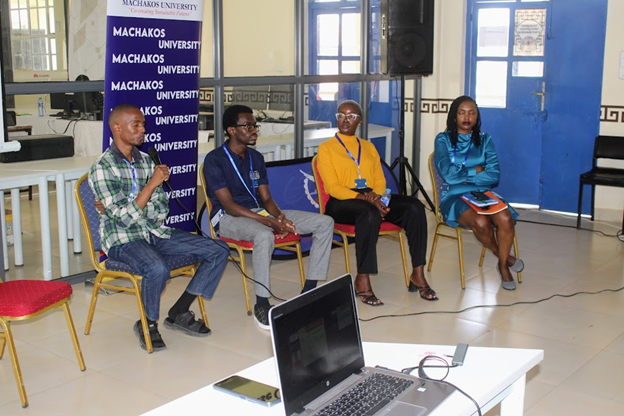 A photo of the MKSU event speakers sat down and presenting to attendees.