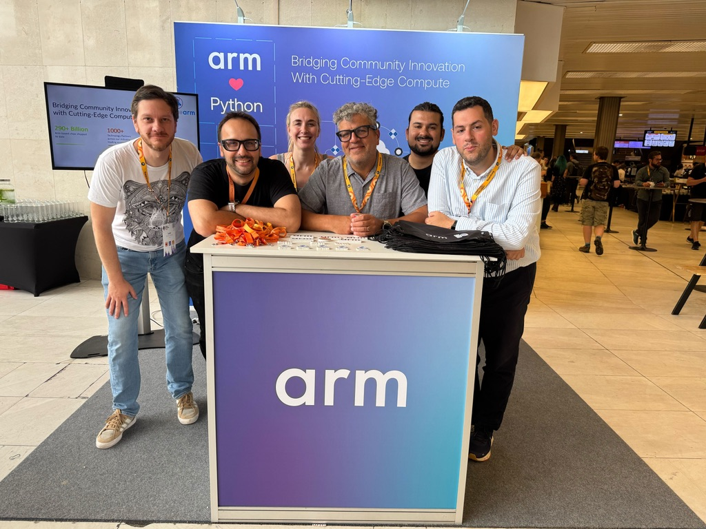 Arm team at their booth at EuroPython 2025