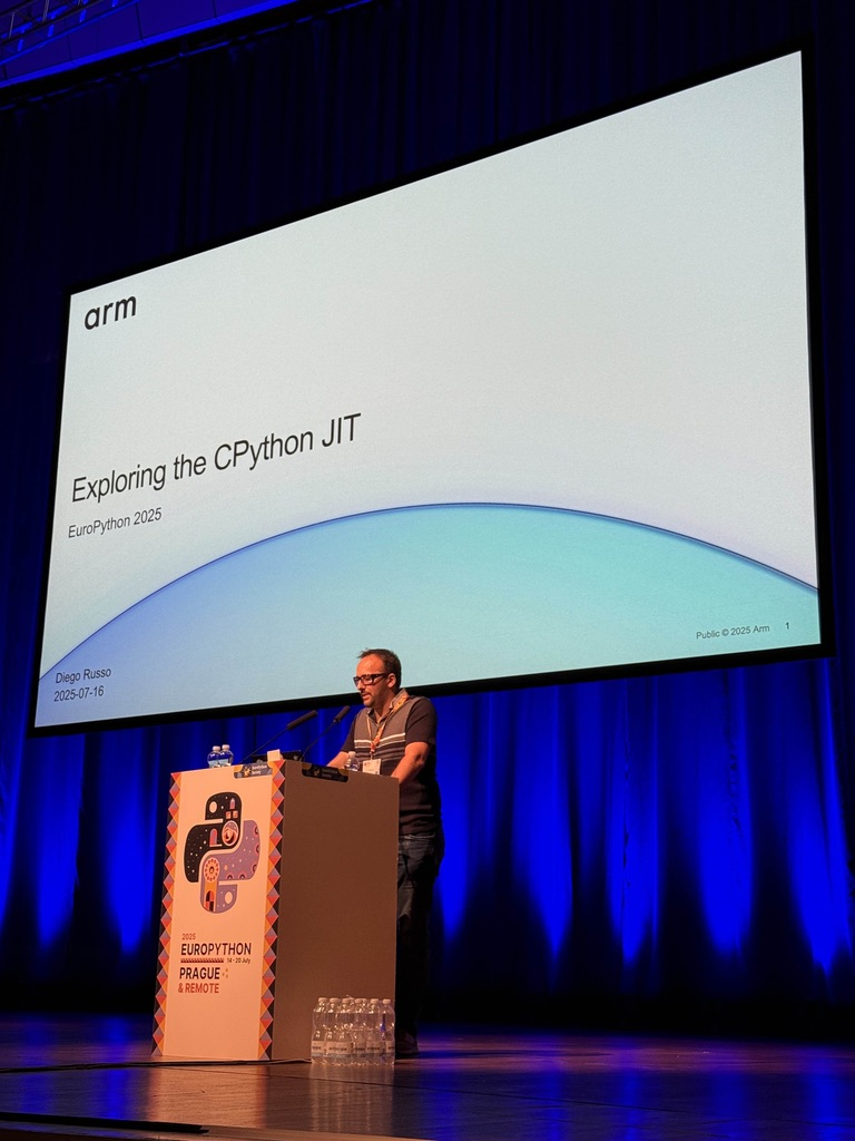 Diego Russo on stage presenting at EuroPython 2025