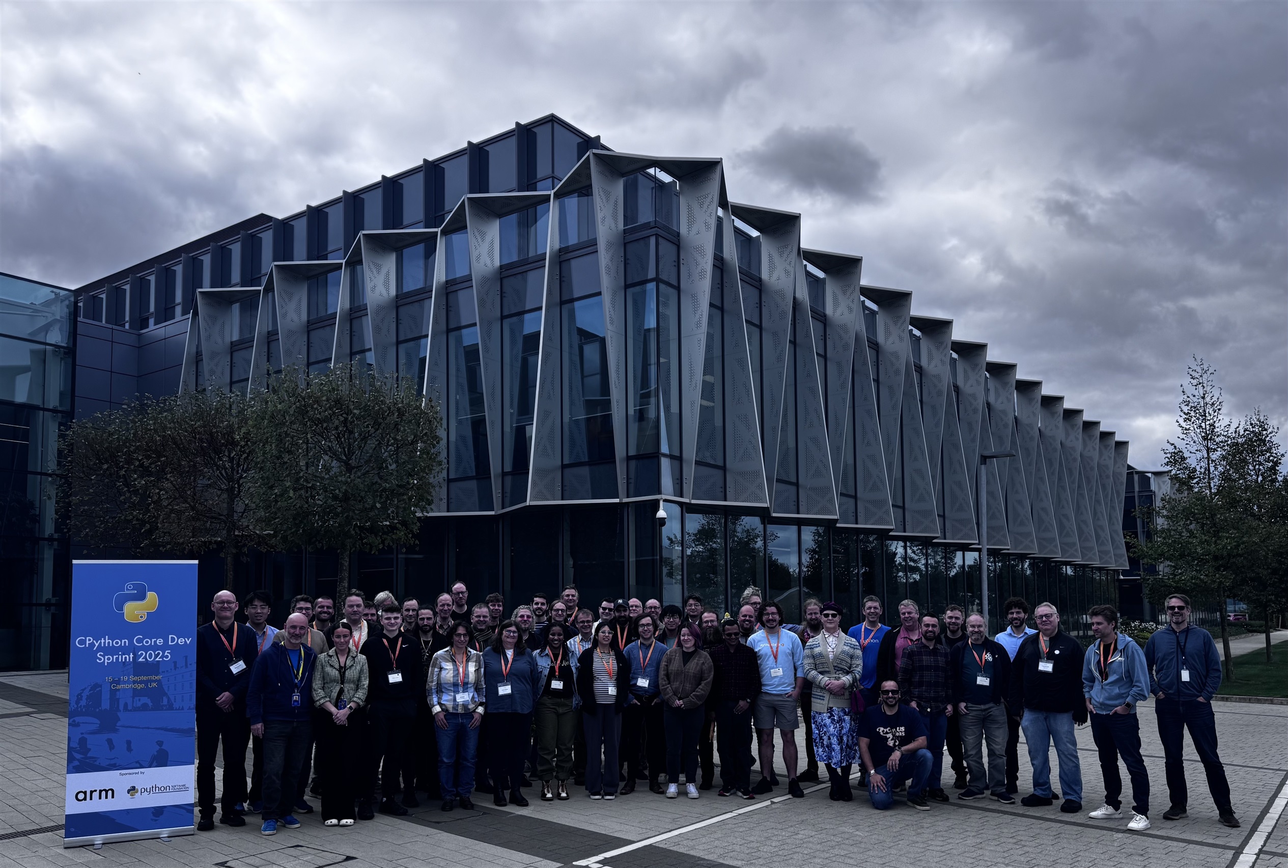 Picture of all the event attendees standing outside the Arm Cambridge headquarters