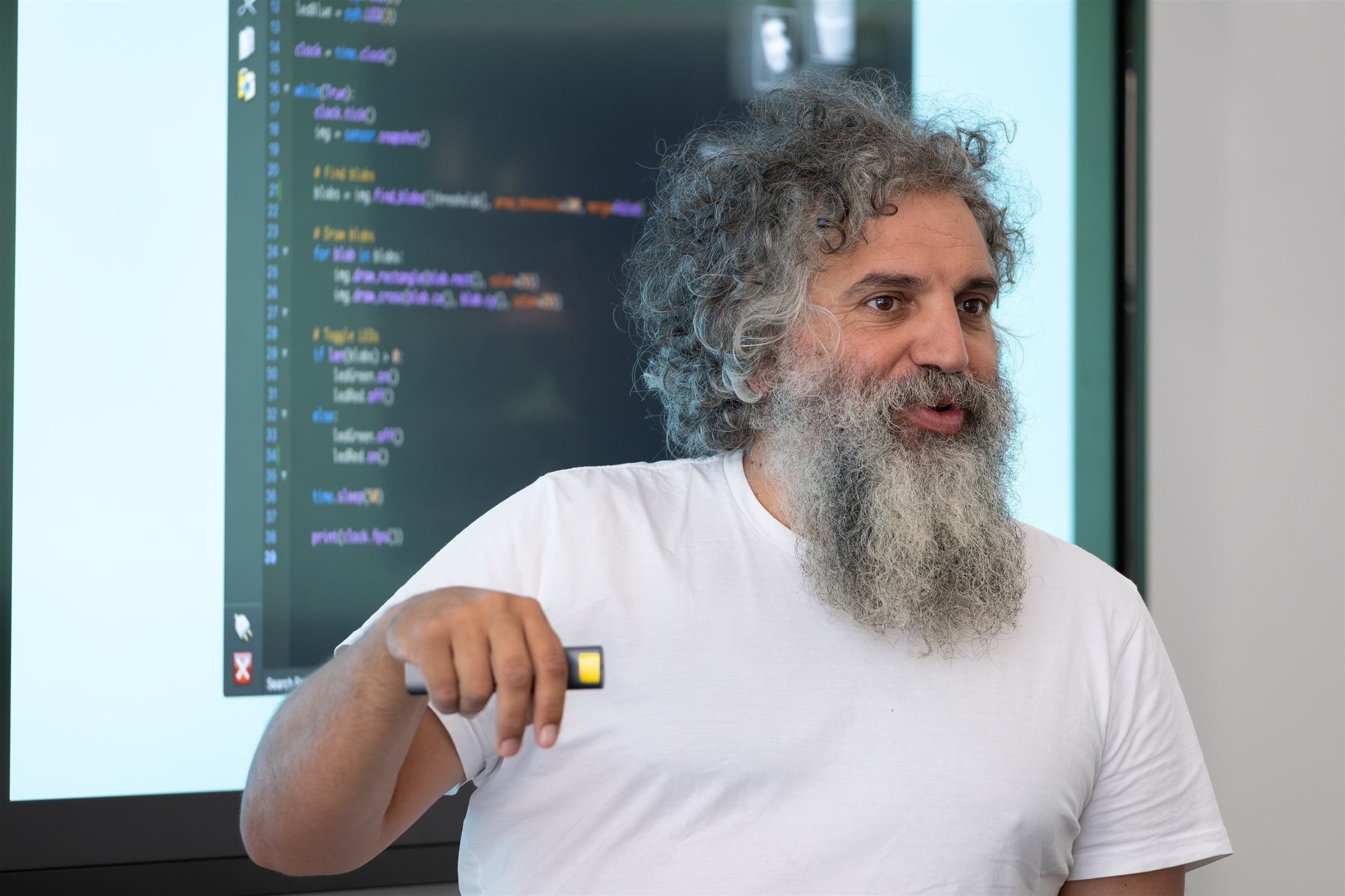 Speaker with code in background