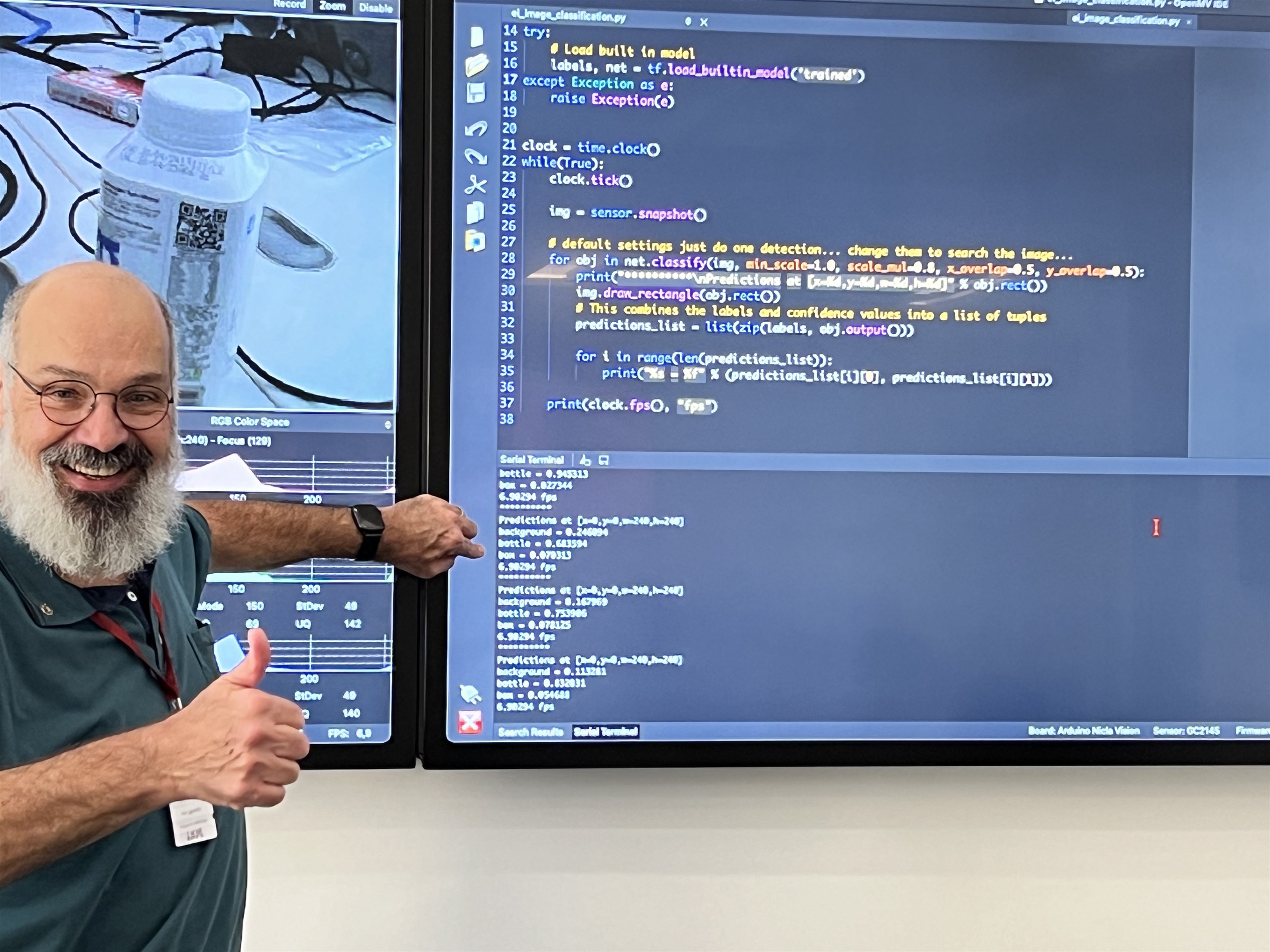 Attendee pointing to code