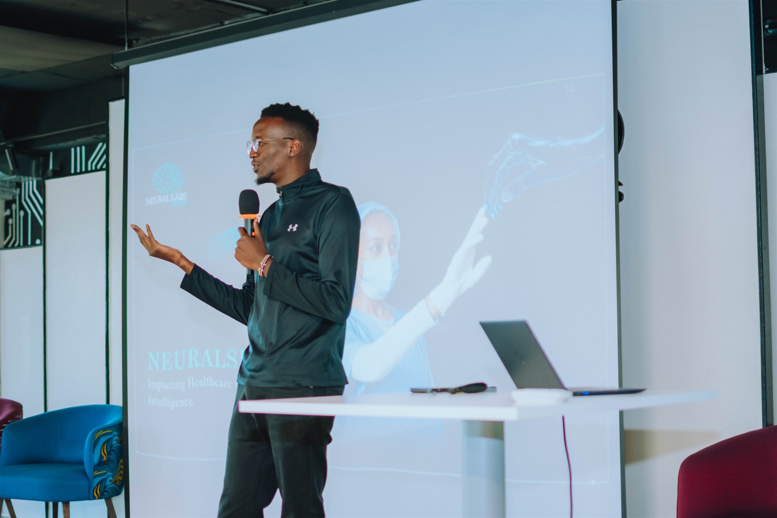 Co-founder and CTO of Neural Labs Africa, Tom Kinyanjui on stage