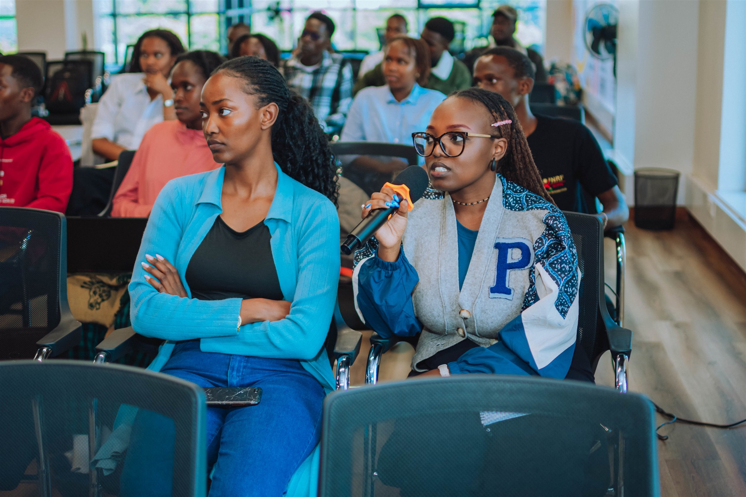 Audience asking questions during one of the sessions