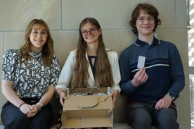 A close up of the Cat Scanner project team with their project.