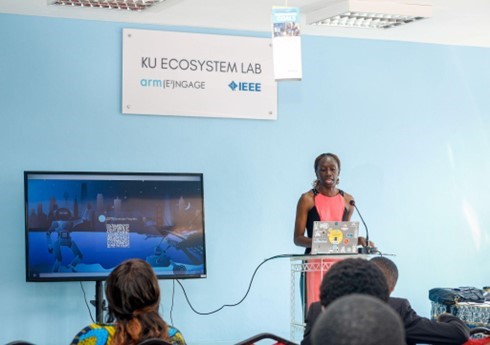 A photo of Brenda giving a talk on the benefits and opportunities available through the program.