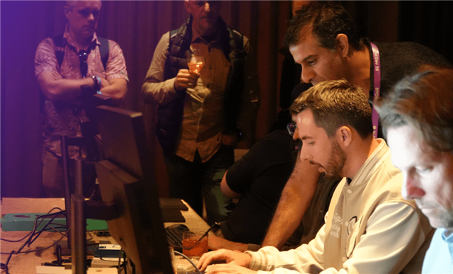 alt text for this image  Developers explore AI and graphics workflows during a hands-on Arm Create event demonstration.