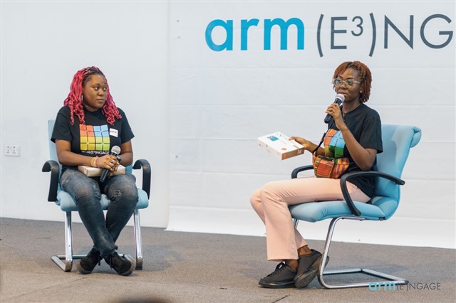 Panel discussion at the Arm Engage event, with two speakers discussing technology and developer topics on stage.